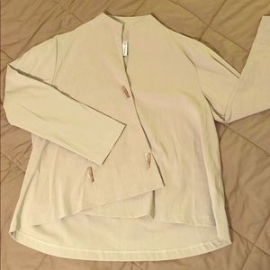Beige asymmetric jacket with faux horn buttons